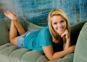 Chelsea Hahn - aqua shirt on couch 2